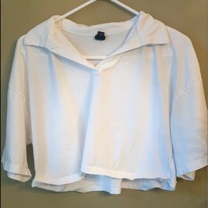 White boxy crop top with color.